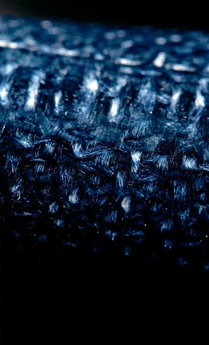 Close-up of Prussian blue jute micarta handle material used on Shun Shiranami knives